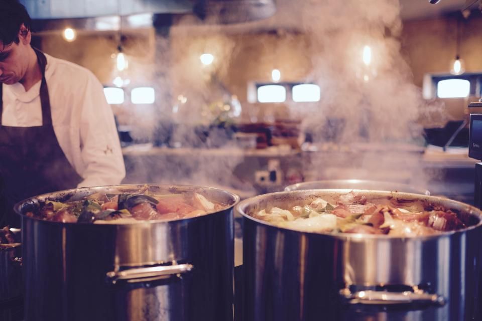 A cook working at the open kitchen