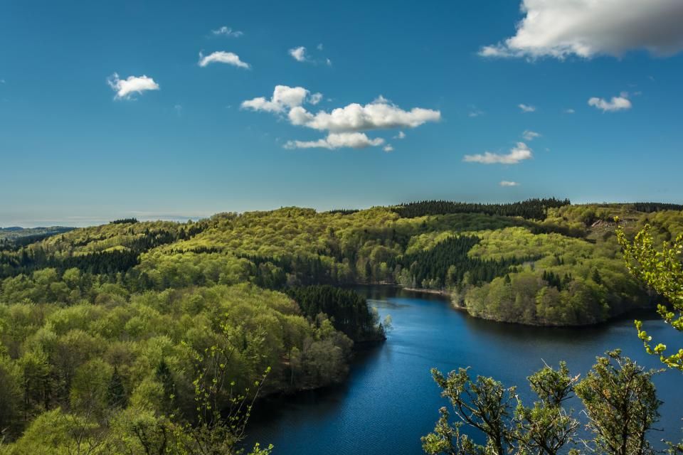 The lake, still, with hills behind